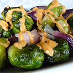 Roasted Brussels Sprouts and Onions with Sriracha Cream